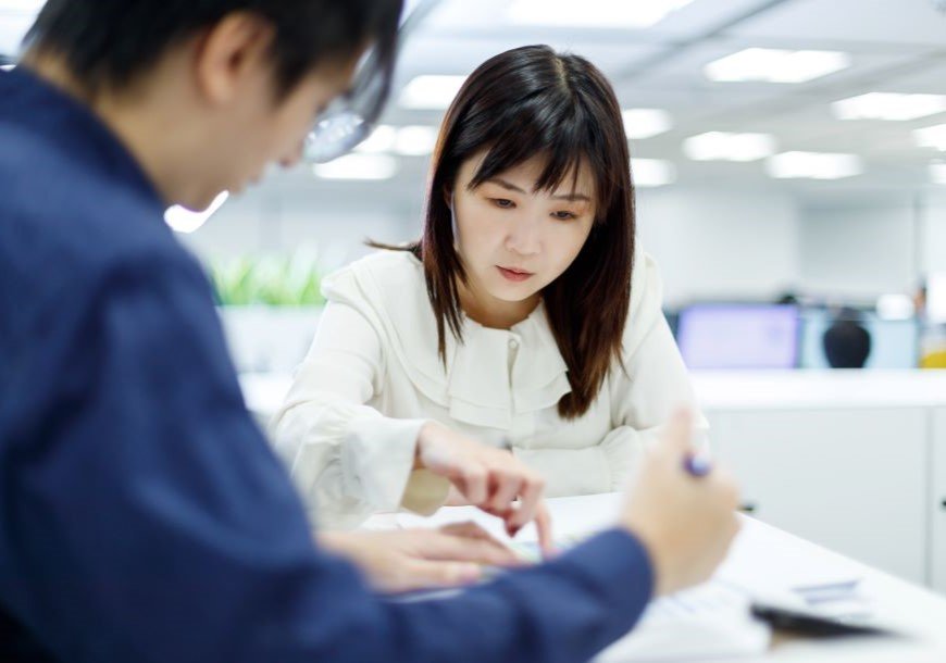 Two people review project data together