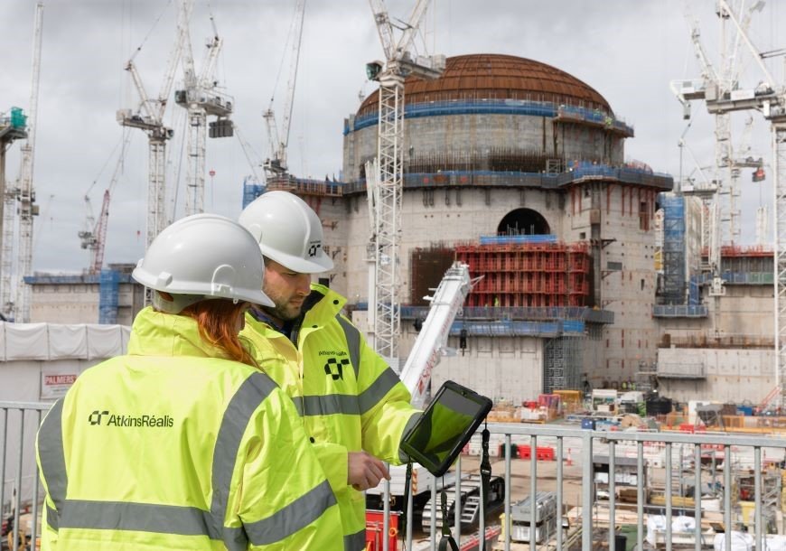 Two people review data on site at Sizewell C