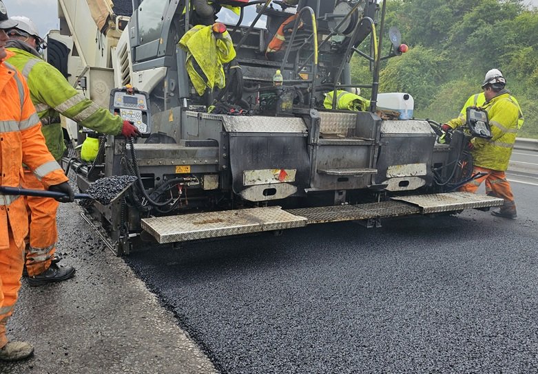 asphalt being laid on road